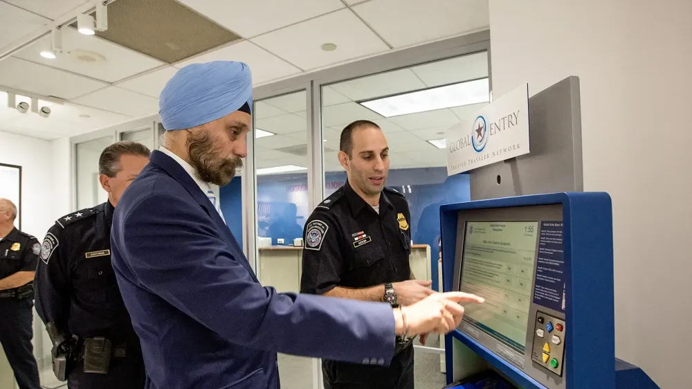 ambassador to India Ambassador Navtej Sarna uses global entry kiosk